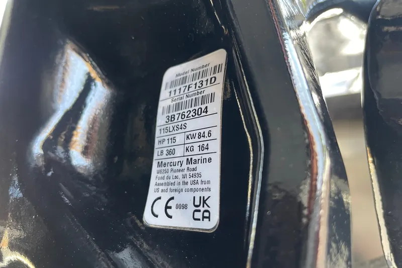 Slide: The Image of Label on a 2027 Tracker Pro Team 190, displaying model and serial numbers. - 54