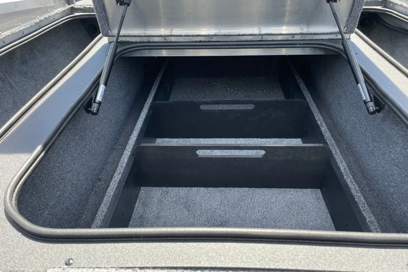 Slide: The Image of Open storage compartment in 2027 Tracker Pro Team 190 boat. - 23