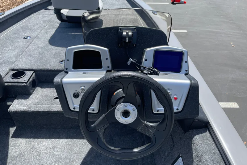 Slide: The Image of Steering console of 2027 Tracker Pro Team 190 boat with dual displays and controls. - 13