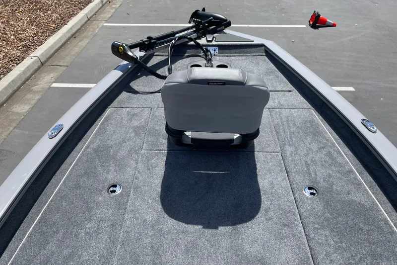 Slide: The Image of 2027 Tracker Pro Team 190 boat interior with gray seating and carpeted deck. - 18