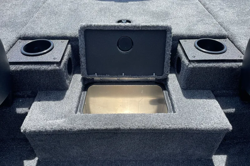 Slide: The Image of 2027 Tracker Pro Team 190 boat interior with storage compartment and cup holders. - 17