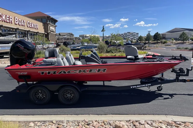 Slide: The Image of Red 2027 Tracker Pro Team 195 boat on trailer at Tracker Boat Center. - 16