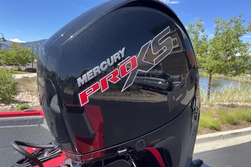 Slide: The Image of Mercury Pro XS engine on 2027 Tracker Pro Team 195 boat, outdoors. - 18