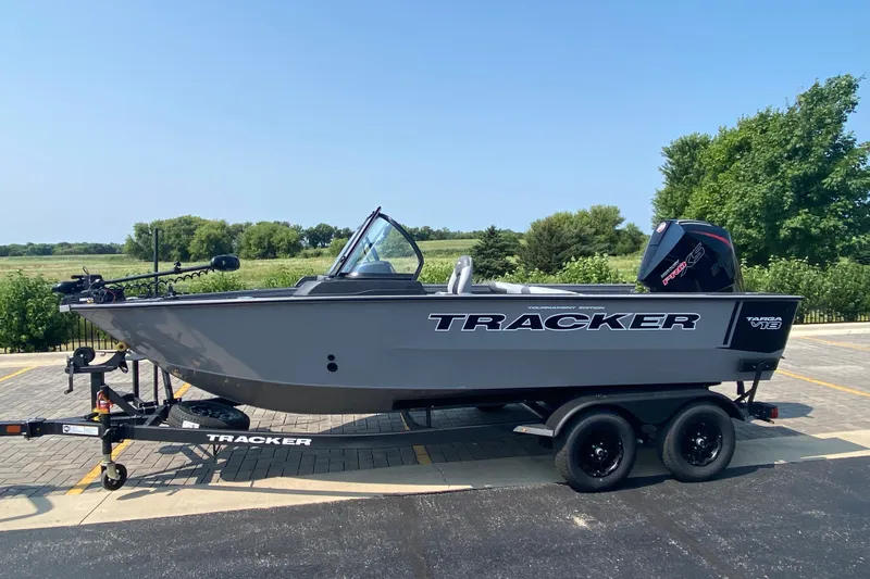 The Image of 2027 Tracker Targa V-18 Combo boat on trailer, parked outdoors. - 0