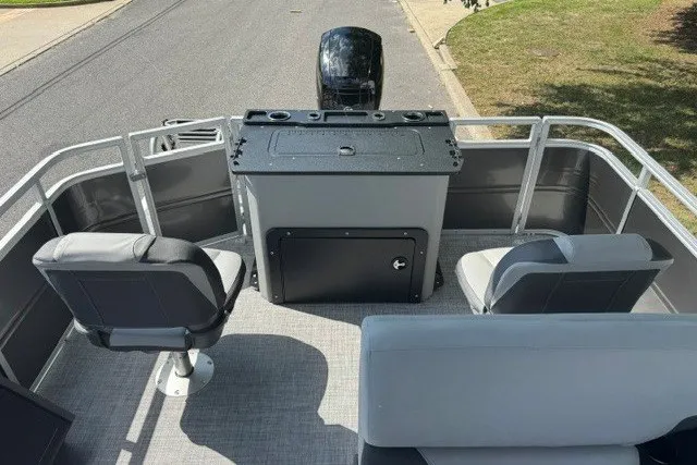 Slide: The Image of 2027 Sun Tracker SportFish 22 DLX pontoon boat interior with seating and console. - 13
