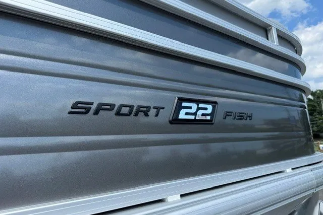 Slide: The Image of 2027 Sun Tracker SportFish 22 DLX boat exterior with model nameplate. - 24