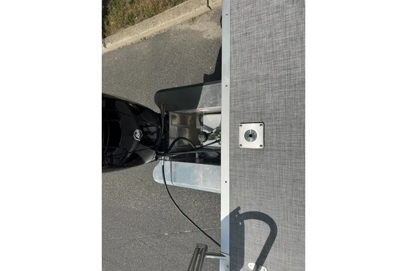 Slide: The Image of Overhead view of 2027 Sun Tracker SportFish 22 DLX boat deck and motor. - 22