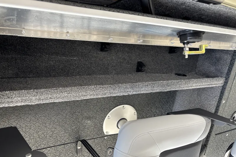 Slide: The Image of Interior view of 2027 Tracker Pro Guide V-16 WT boat, showcasing seating and storage area. - 31
