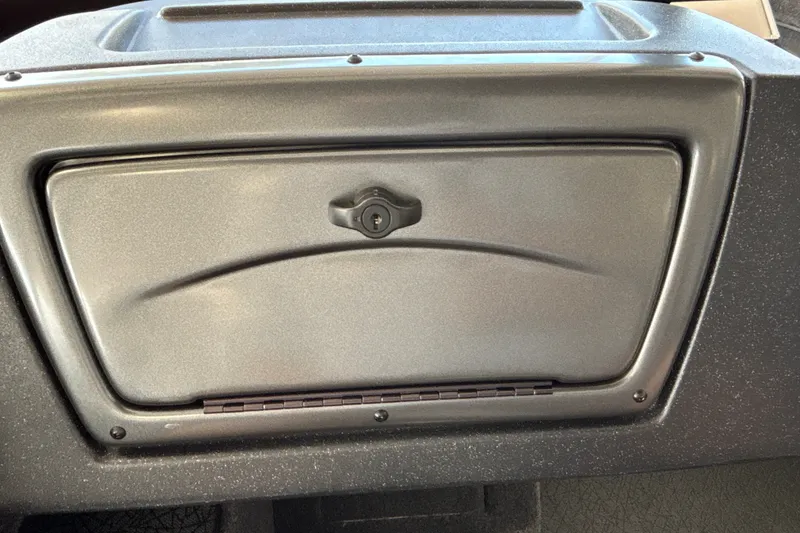 Slide: The Image of 2027 Tracker Pro Guide V-16 WT glove compartment with lock, featuring a sleek design. - 22