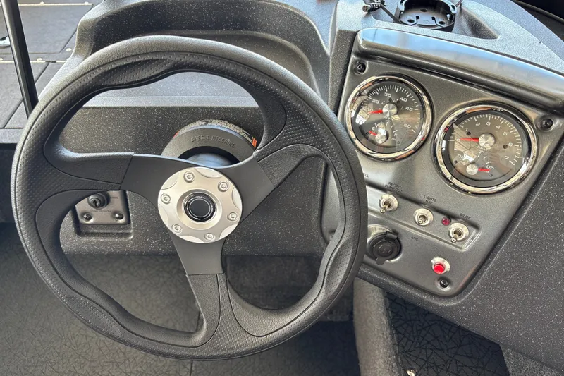 Slide: The Image of Steering wheel and dashboard of 2027 Tracker Pro Guide V-16 WT boat. - 20