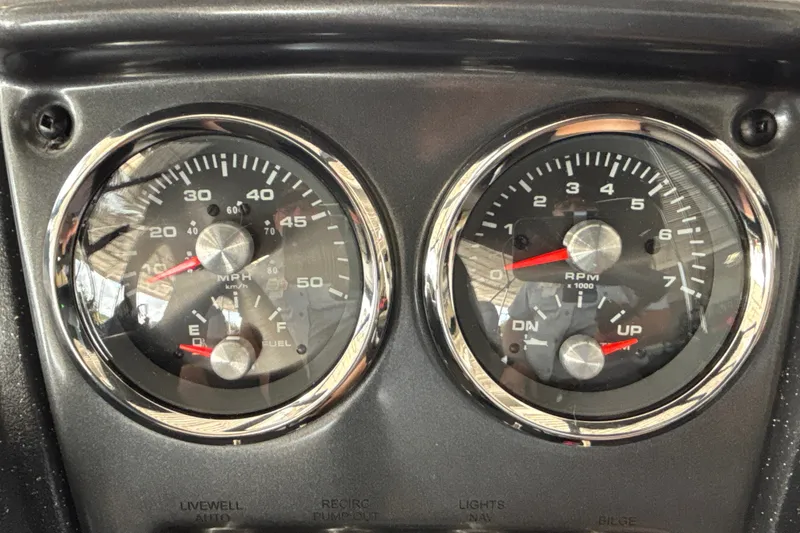 Slide: The Image of Dashboard of 2027 Tracker Pro Guide V-16 WT with speedometer and RPM gauges. - 21