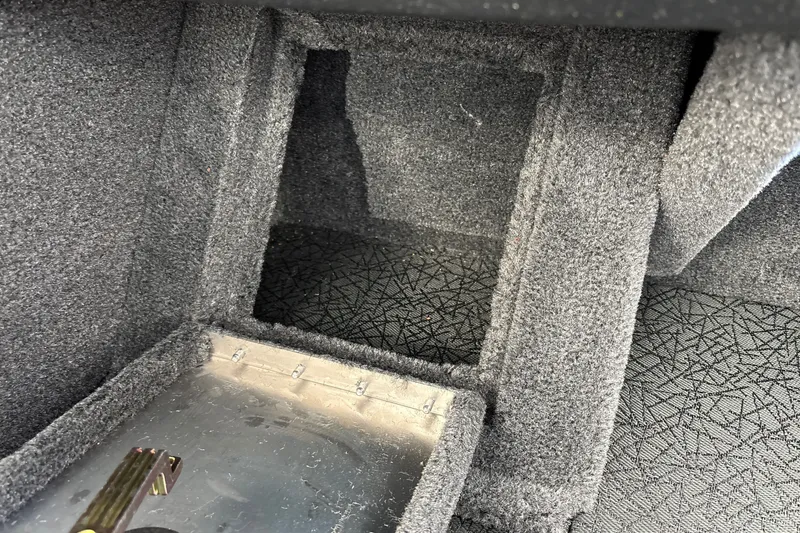 Slide: The Image of Interior view of 2027 Tracker Pro Guide V-16 WT boat storage compartment. - 25