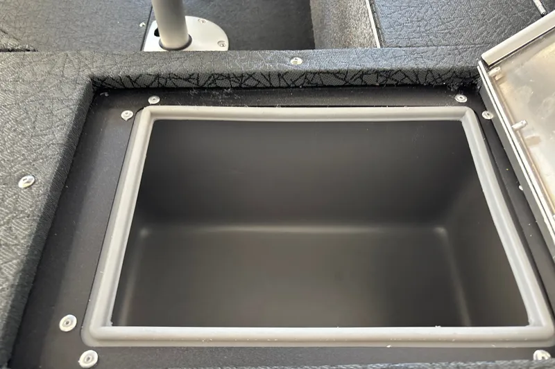 Slide: The Image of 2027 Tracker Pro Guide V-16 WT boat storage compartment, open and empty. - 29
