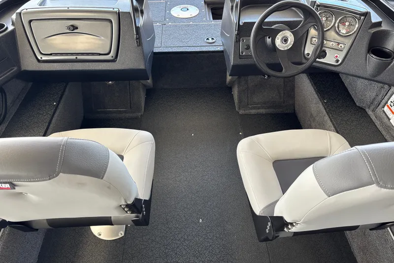 Slide: The Image of Interior of 2027 Tracker Pro Guide V-16 WT boat with dual seats and steering console. - 14