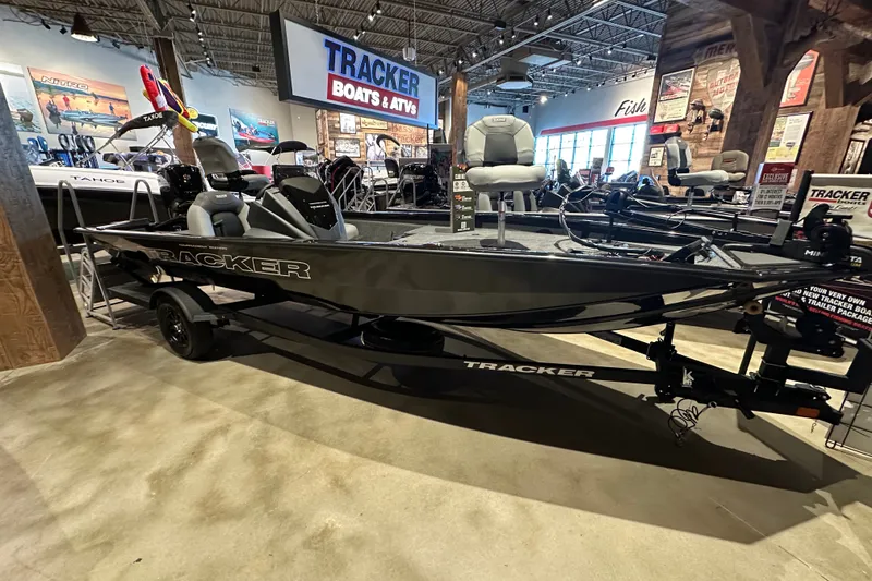 The Image of 2027 Tracker Pro Team 190 boat displayed in showroom with Tracker branding. - 0