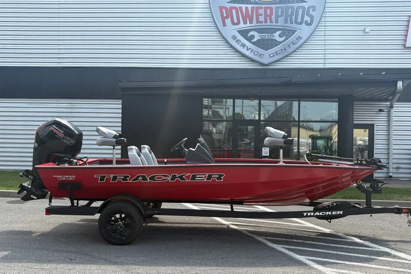 The Image of 2027 Tracker Pro Team 195 boat in red, parked outside Power Pros Service Center. - 0