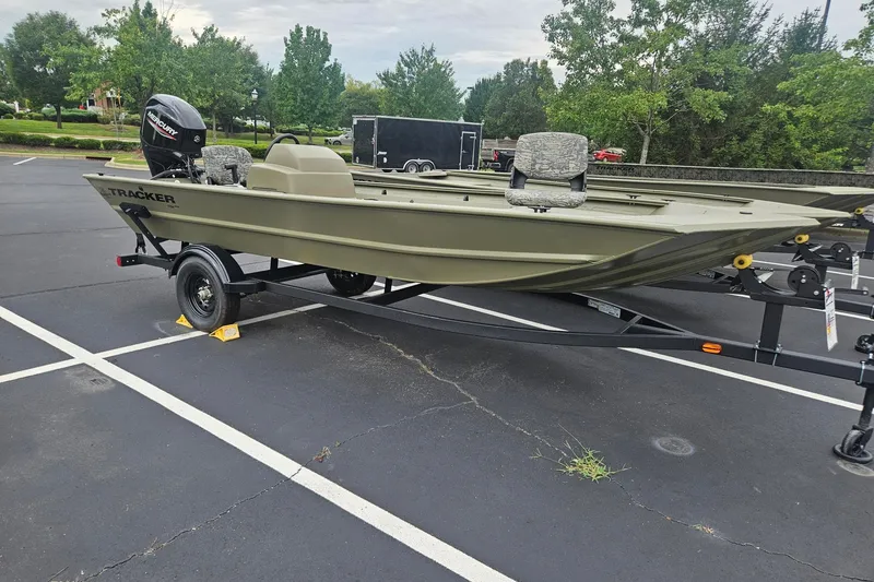 The Image of 2027 Tracker Grizzly 1754 SC boat on trailer in parking lot. - 0
