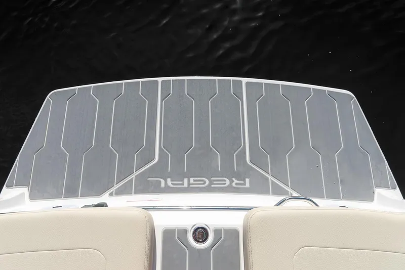Slide: The Image of Manufacturer Provided Image: 2026 Regal LS6 boat swim platform with sleek design and branding. - 13