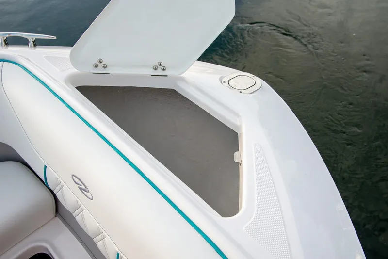 Slide: The Image of Manufacturer Provided Image: Open storage compartment on 2026 Regal LS6 boat, featuring sleek white design. - 9