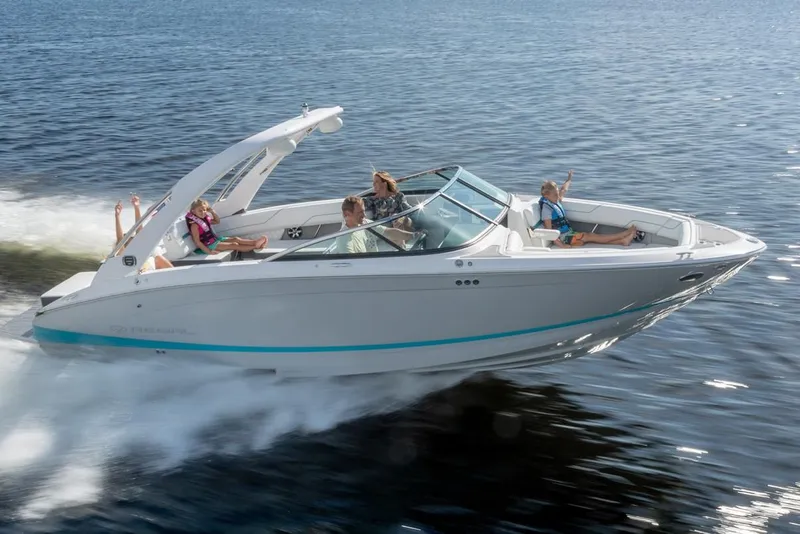 Slide: The Image of Manufacturer Provided Image: 2026 Regal LS6 boat cruising on open water with passengers enjoying the ride. - 0