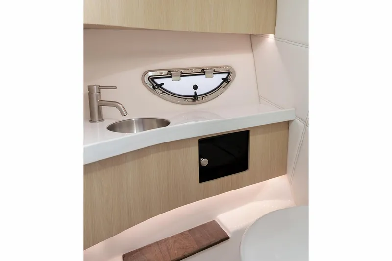 Slide: The Image of Manufacturer Provided Image: 2026 Regal LS9 boat interior with modern sink and sleek cabinetry. - 7