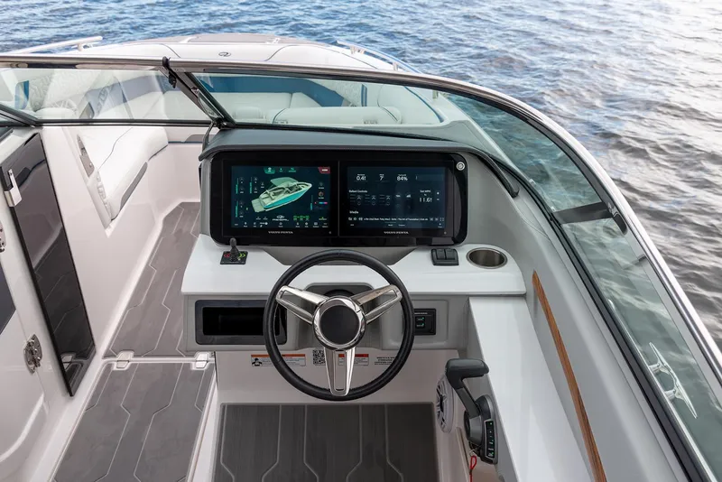 Slide: The Image of Manufacturer Provided Image: 2026 Regal LS9 boat cockpit with modern navigation screens and steering wheel on open water. - 5