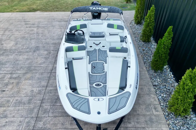 Slide: The Image of 2022 Tahoe T18 boat with sleek design, spacious seating, and modern features. - 10