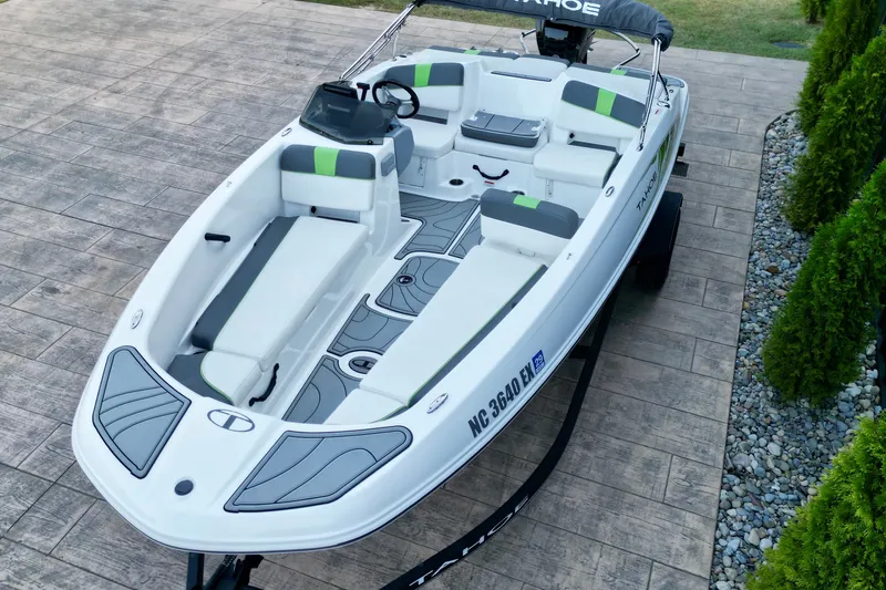 Slide: The Image of 2022 Tahoe T18 boat on trailer, featuring sleek design and comfortable seating. - 9
