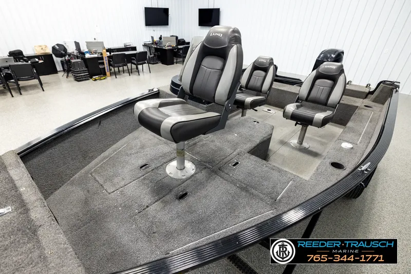 Slide: The Image of 2017 Lund 1650 Rebel XS SS boat interior with three seats in showroom. - 8