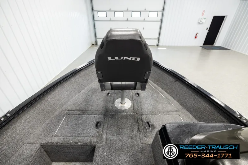 Slide: The Image of 2017 Lund 1650 Rebel XS SS boat interior with single seat and carpeted deck. - 13