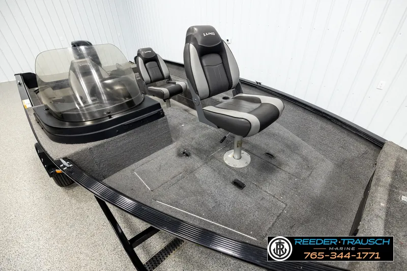 Slide: The Image of 2017 Lund 1650 Rebel XS SS boat interior with seating and windshield. - 7