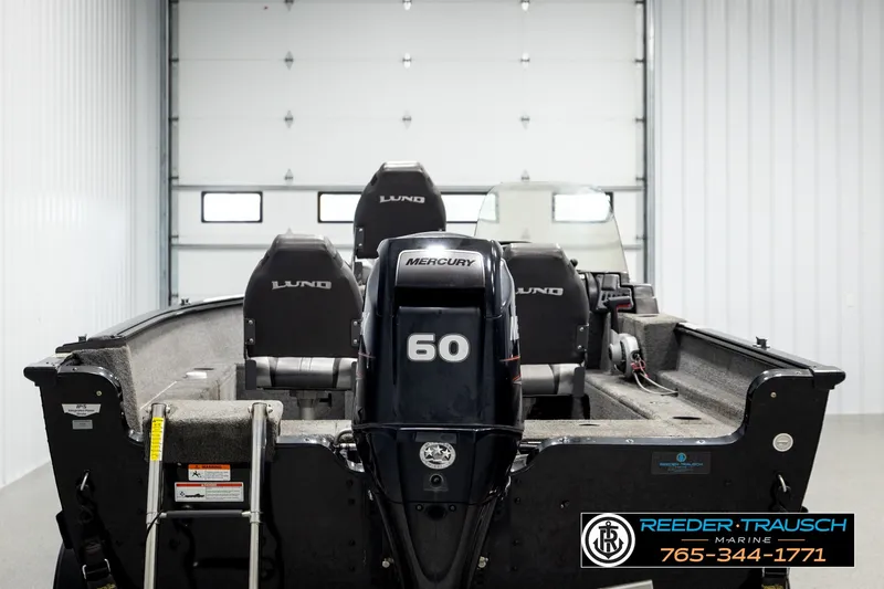 Slide: The Image of 2017 Lund 1650 Rebel XS SS boat with Mercury 60 engine in a garage. - 5