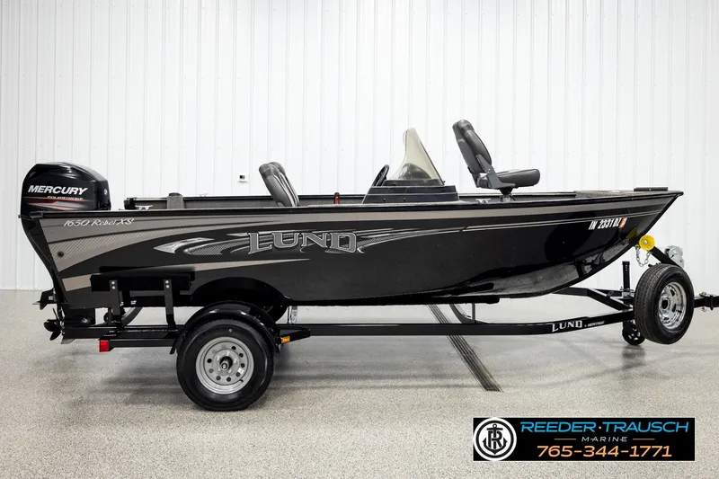Slide: The Image of 2017 Lund 1650 Rebel XS SS fishing boat with Mercury outboard motor on trailer. - 3