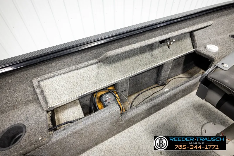 Slide: The Image of 2017 Lund 1650 Rebel XS SS boat interior storage compartment with wiring and equipment. - 21
