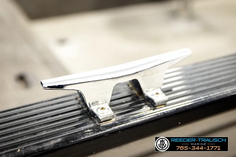 Slide: The Image of Chrome cleat on 2017 Lund 1650 Rebel XS SS boat, Reeder Trausch Marine branding visible. - 45