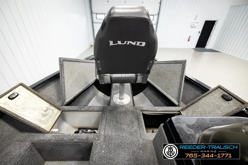 Slide: The Image of 2017 Lund 1650 Rebel XS SS boat interior with storage compartments open. - 25