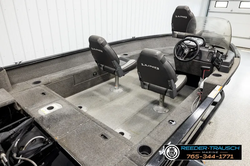Slide: The Image of 2017 Lund 1650 Rebel XS SS fishing boat interior with two seats and steering console. - 10