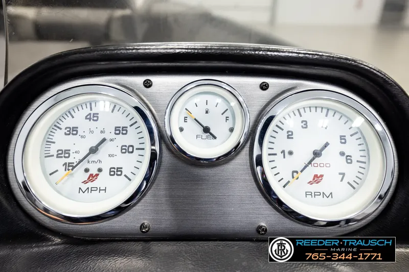Slide: The Image of Dashboard gauges of a 2017 Lund 1650 Rebel XS SS boat, showing speed, fuel, and RPM. - 29