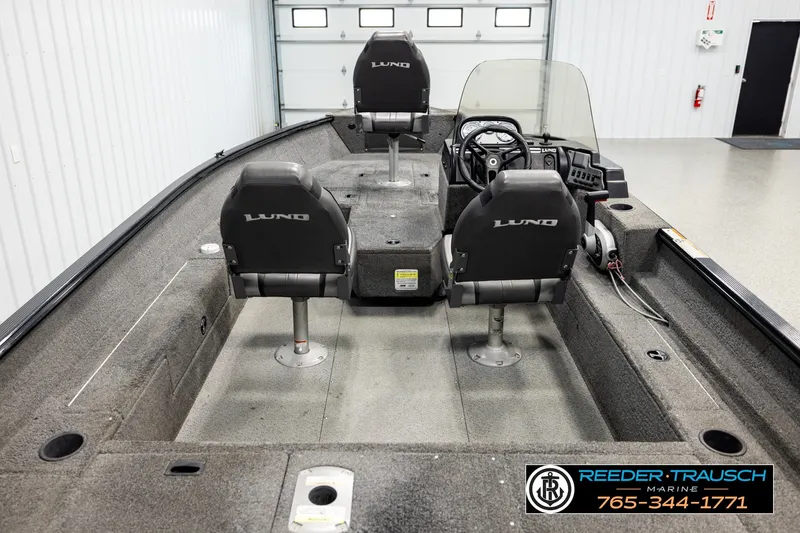 Slide: The Image of 2017 Lund 1650 Rebel XS SS fishing boat interior with dual seats and steering console. - 11