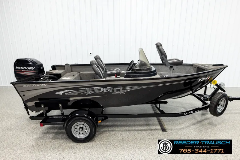 The Image of 2017 Lund 1650 Rebel XS SS fishing boat with Mercury outboard motor on trailer. - 1