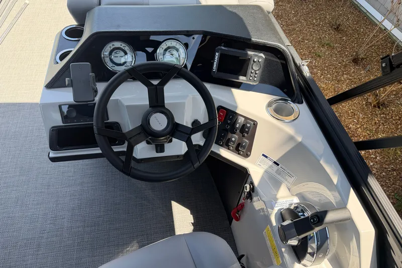 Slide: The Image of Steering console of 2025 Crest Classic 200 boat with gauges and controls. - 12
