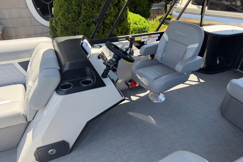Slide: The Image of Interior of 2025 Crest Classic 200 boat with modern helm and comfortable seating. - 10