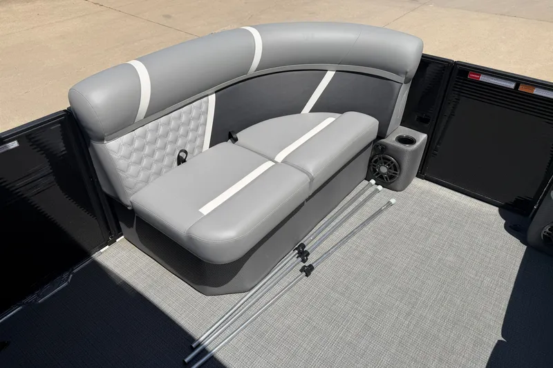 Slide: The Image of Gray seating area on 2025 Crest Classic 200 boat with speakers and storage. - 13