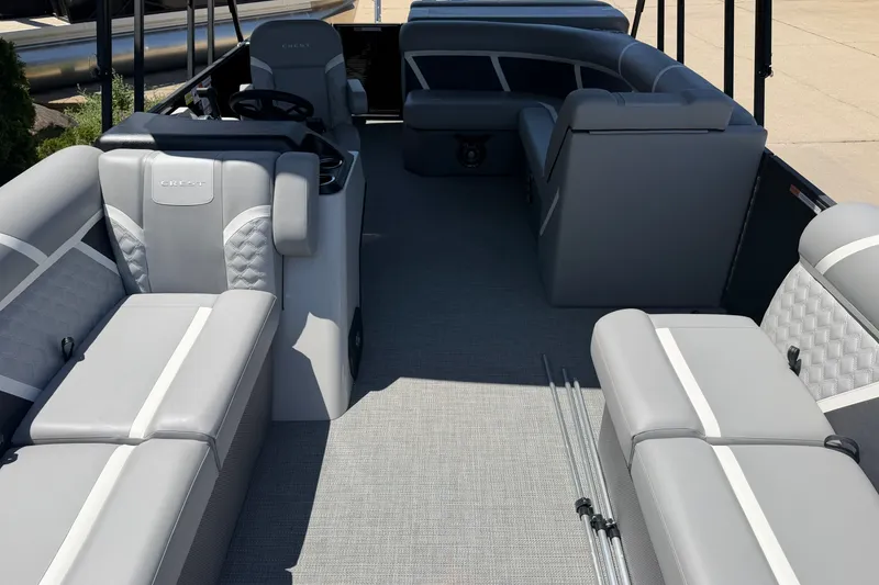 Slide: The Image of Interior of 2025 Crest Classic 200 pontoon boat with gray seating and modern design. - 4