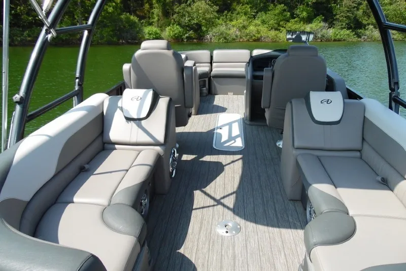 Slide: The Image of 2021 Avalon LSZ Quad Lounge 24' pontoon boat interior with plush seating and sleek design. - 24