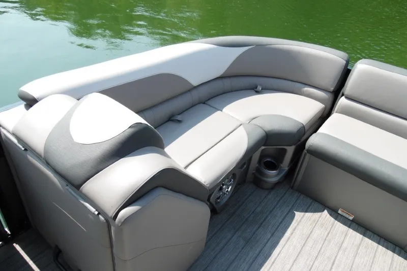 Slide: The Image of 2021 Avalon LSZ Quad Lounge 24' boat interior with plush seating and cup holders. - 13