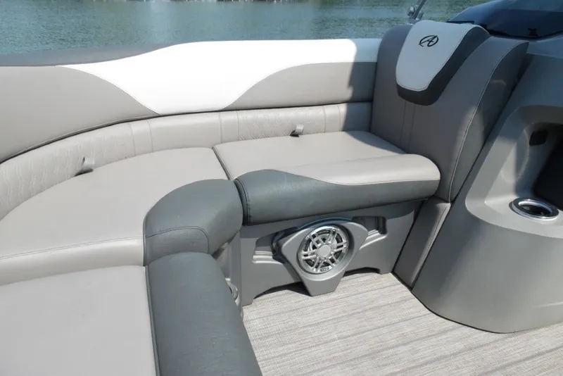 Slide: The Image of 2021 Avalon LSZ Quad Lounge 24' interior with gray seating and speaker detail. - 15