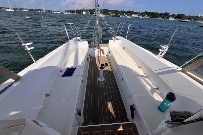 Slide: The Image of Cockpit view of 2023 J Boats J/9 sailboat on water, showcasing seating and deck layout. - 14