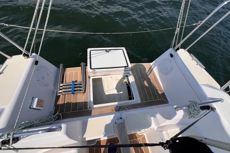 Slide: The Image of 2023 J Boats J/9 sailboat cockpit with open hatch and teak flooring. - 18