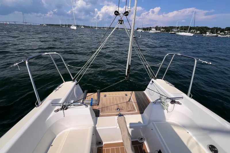 Slide: The Image of 2023 J Boats J/9 sailboat cockpit with scenic ocean view and distant sailboats. - 17